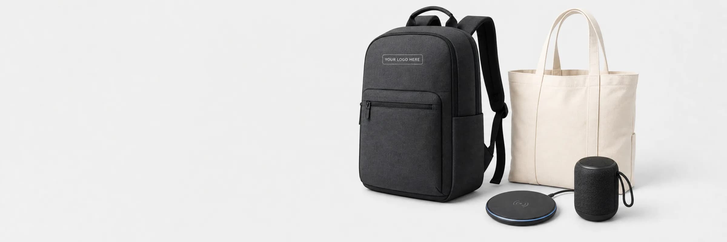 Custom-branded backpack, canvas tote, wireless charging pad and speaker